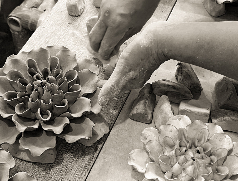 Chive Ceramics artisan shaping a ceramic wall flower by hand — designed in Toronto since 2004.